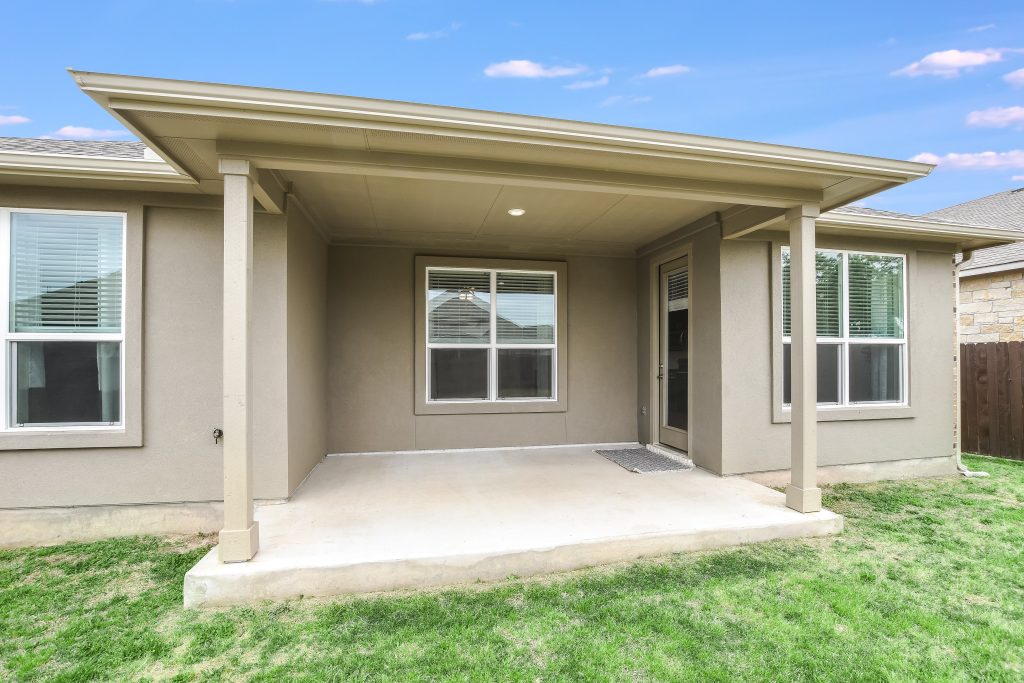Large covered patio to enjoy a breeze passing through this hill top home.